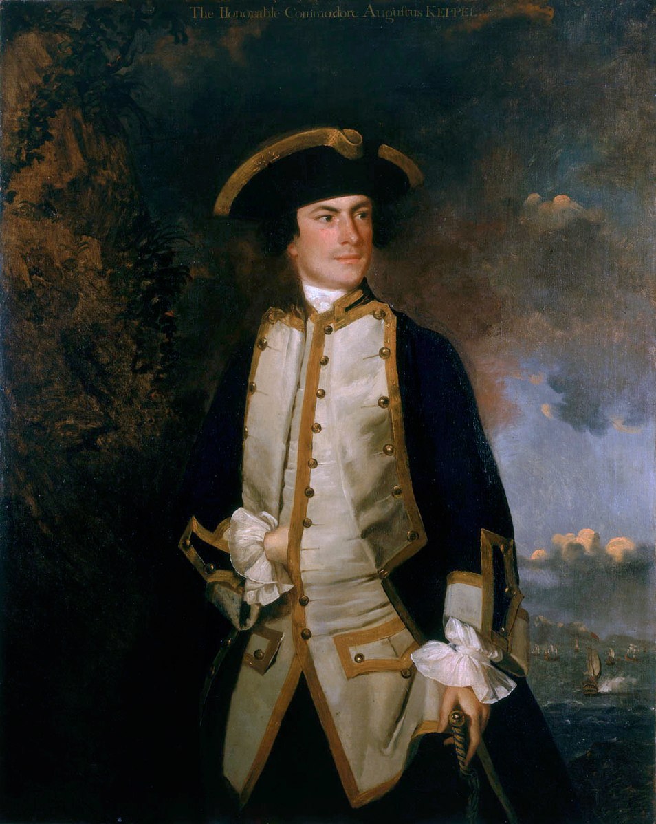 A man wearing a blue, white and gold uniform with a hat