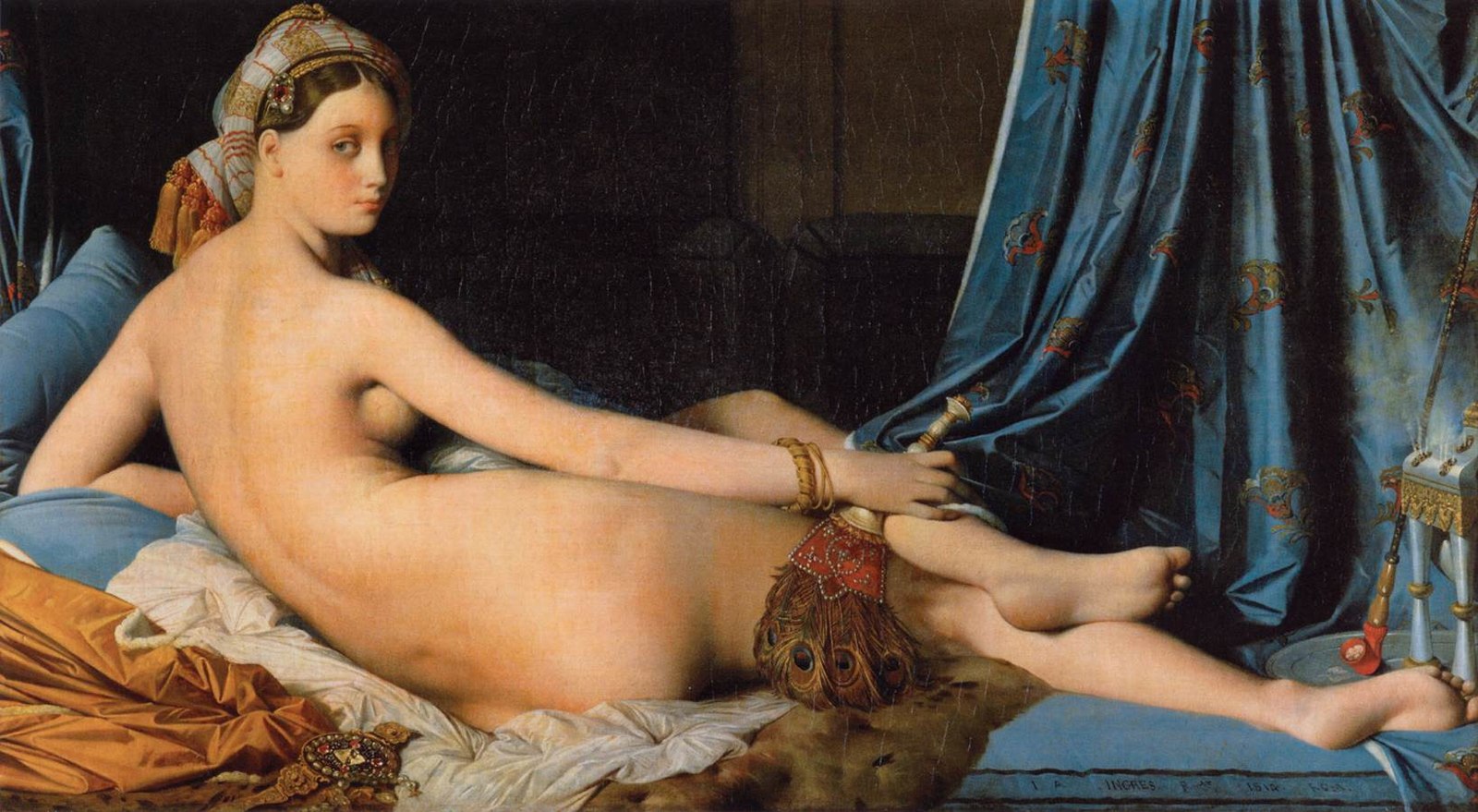 A nude women laying on her side with her back toward the viewer