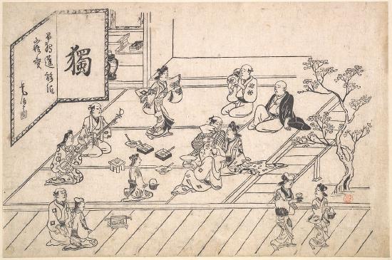Several people inside a room drinking and eating