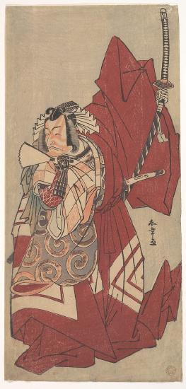A man holding a fan in one hand and a sword in the other hand with a red robe