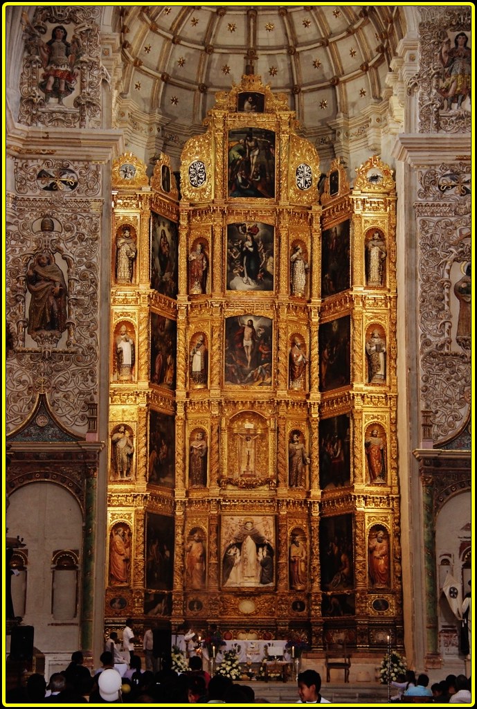 Ornate large church altar with gold and many figures