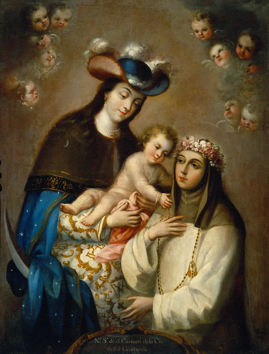 A man and woman holding a baby with other childrens faces at the top