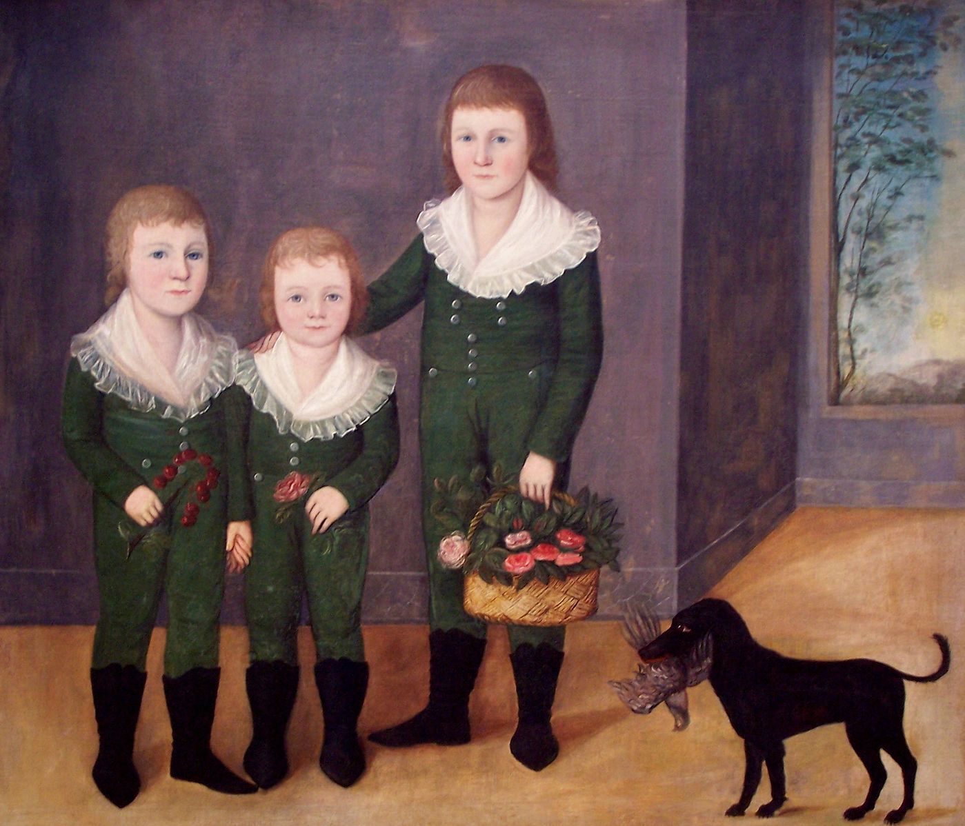 The children all dressed in green one piece jumpsuits and their dog holding a bird