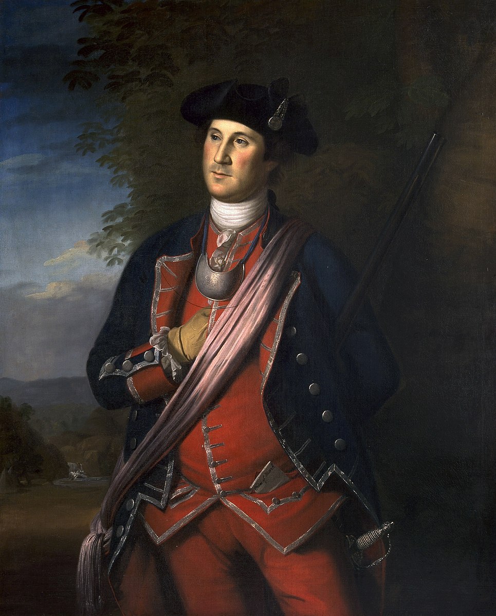 A man wearing a uniform that is blue and red with a hat