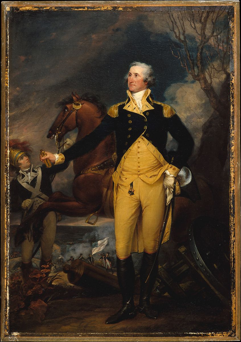 A man standing in uniform of blue and yellow with a horse