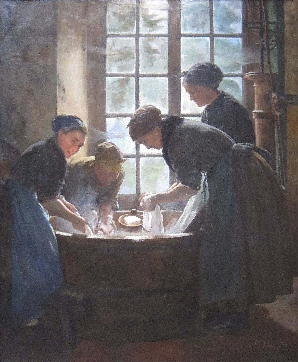 Four woman doing laundry over a hot wooden bucket