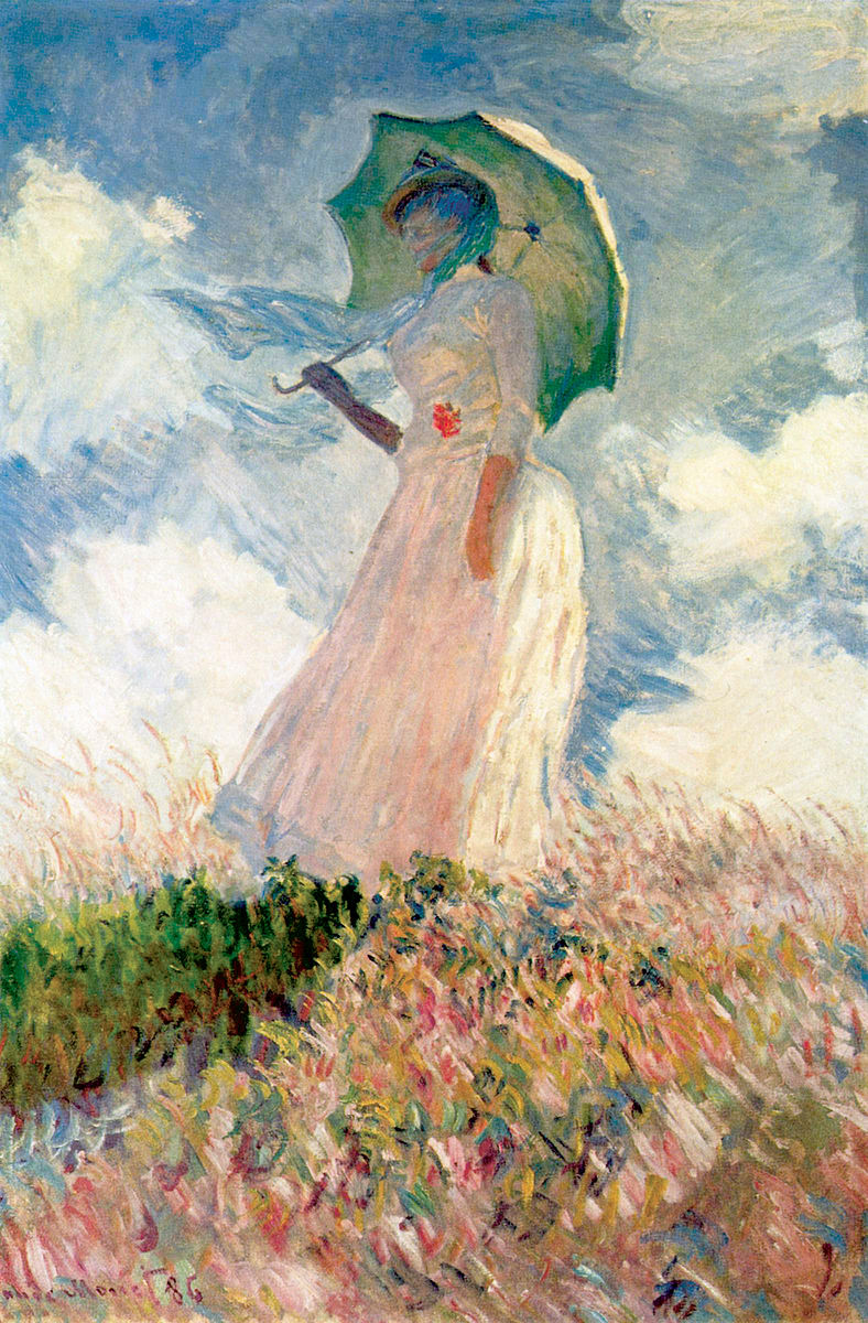 A women dressed in white with a white umbrella standing in a field with blue sky