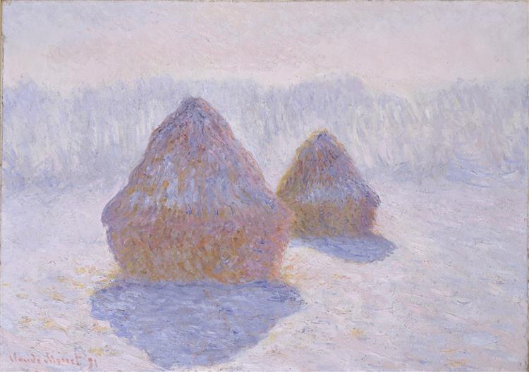 Two haystacks in a field of snow