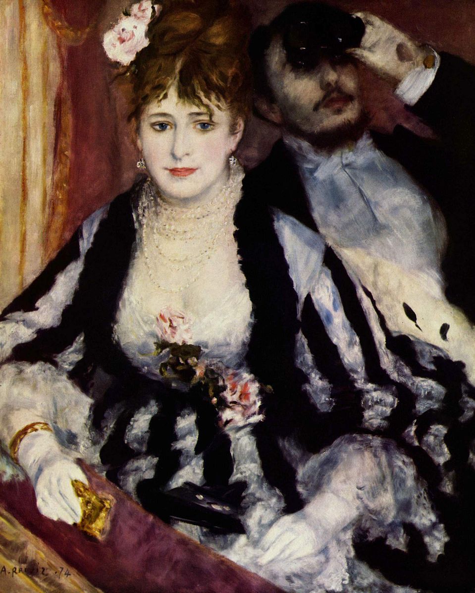 A man and woman dressed up in a balcony suite at the opera