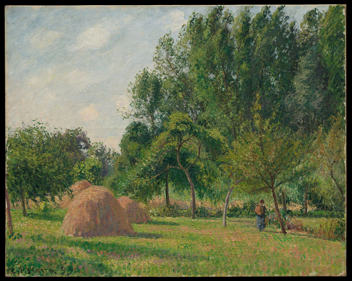Three haystacks in a field with some trees and a person standing