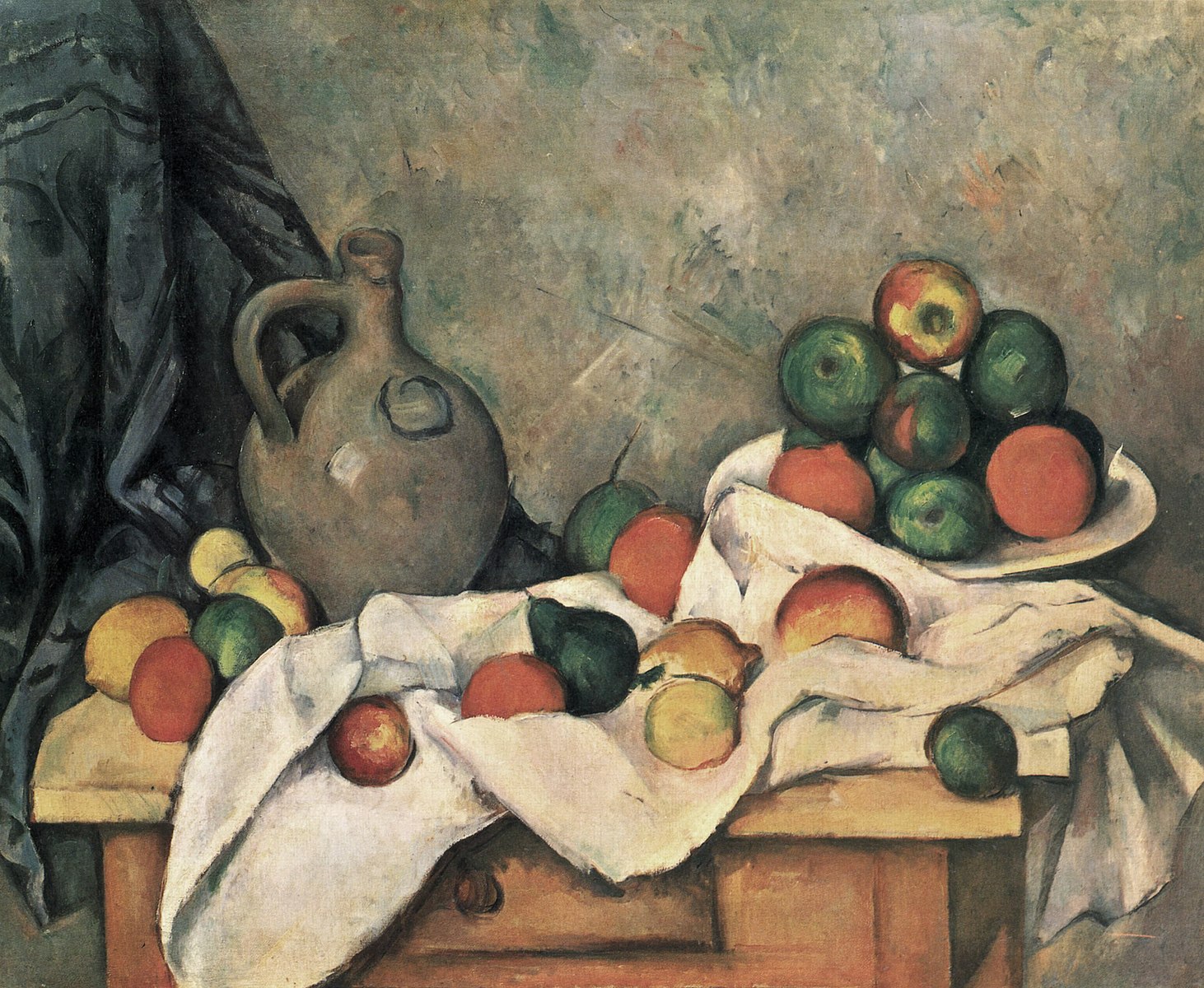 A table draped in white with a bowl of fruit, a pitcher and fruit on the table 