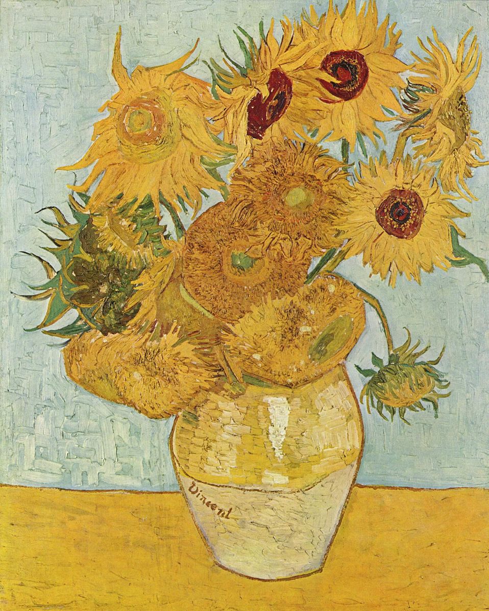A vase of sunflowers sitting on a table