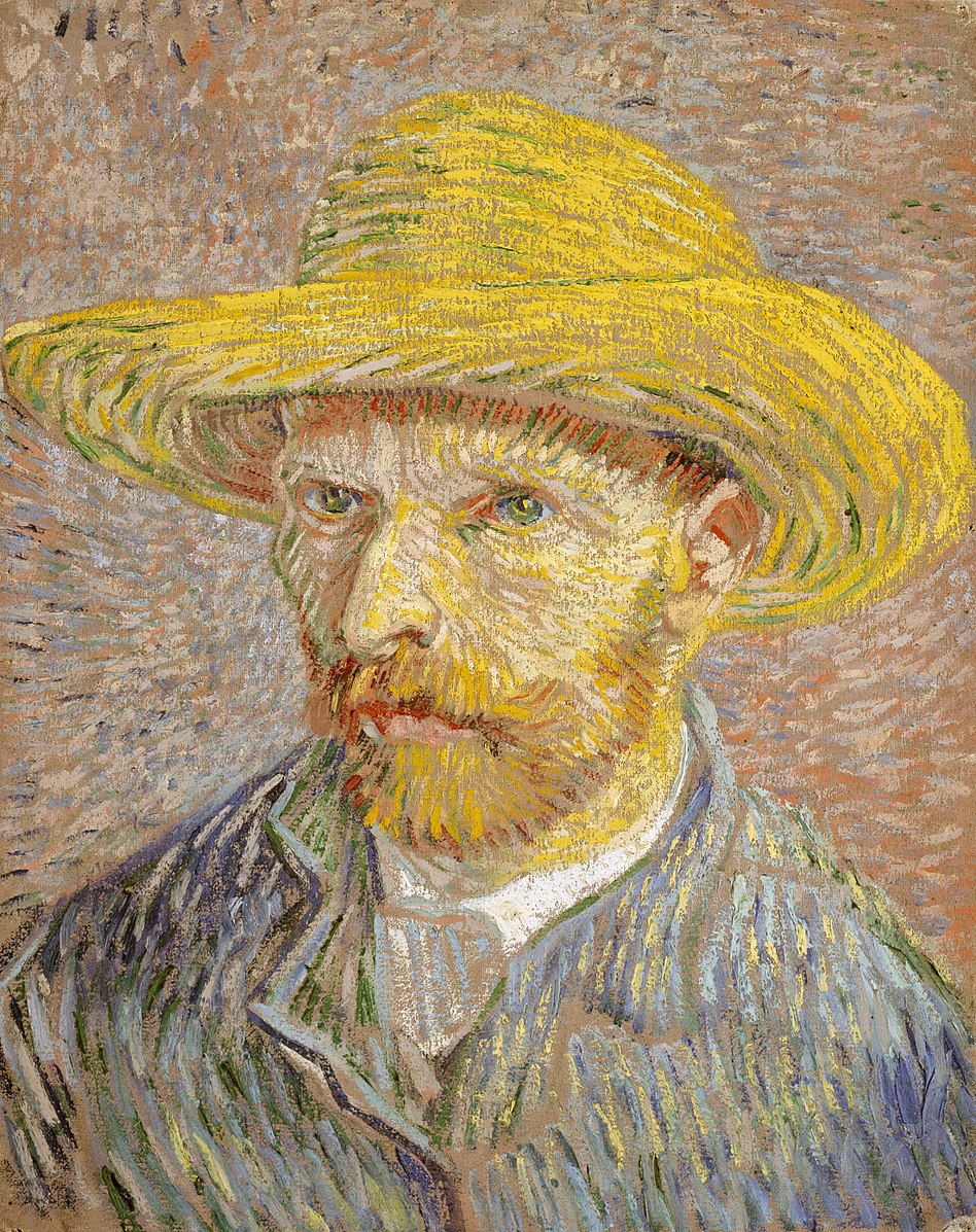 Portrait of a man wearing a blue jacket and a straw hat