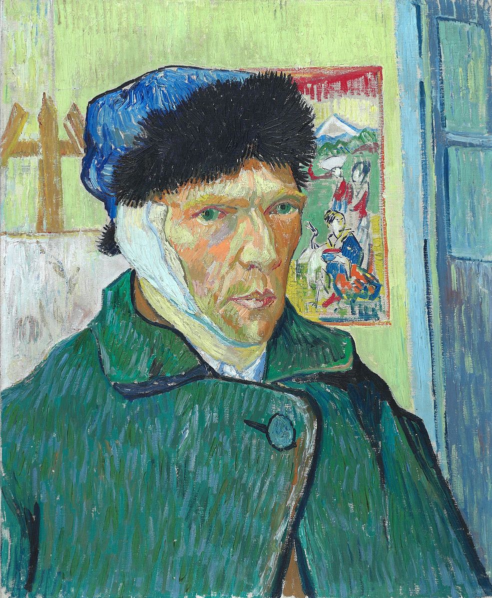 Portrait of a man wearing a green jacket and blue hat with a bandaged ear