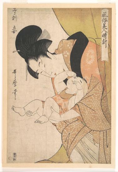 A woman wearing a floral robe holding a baby