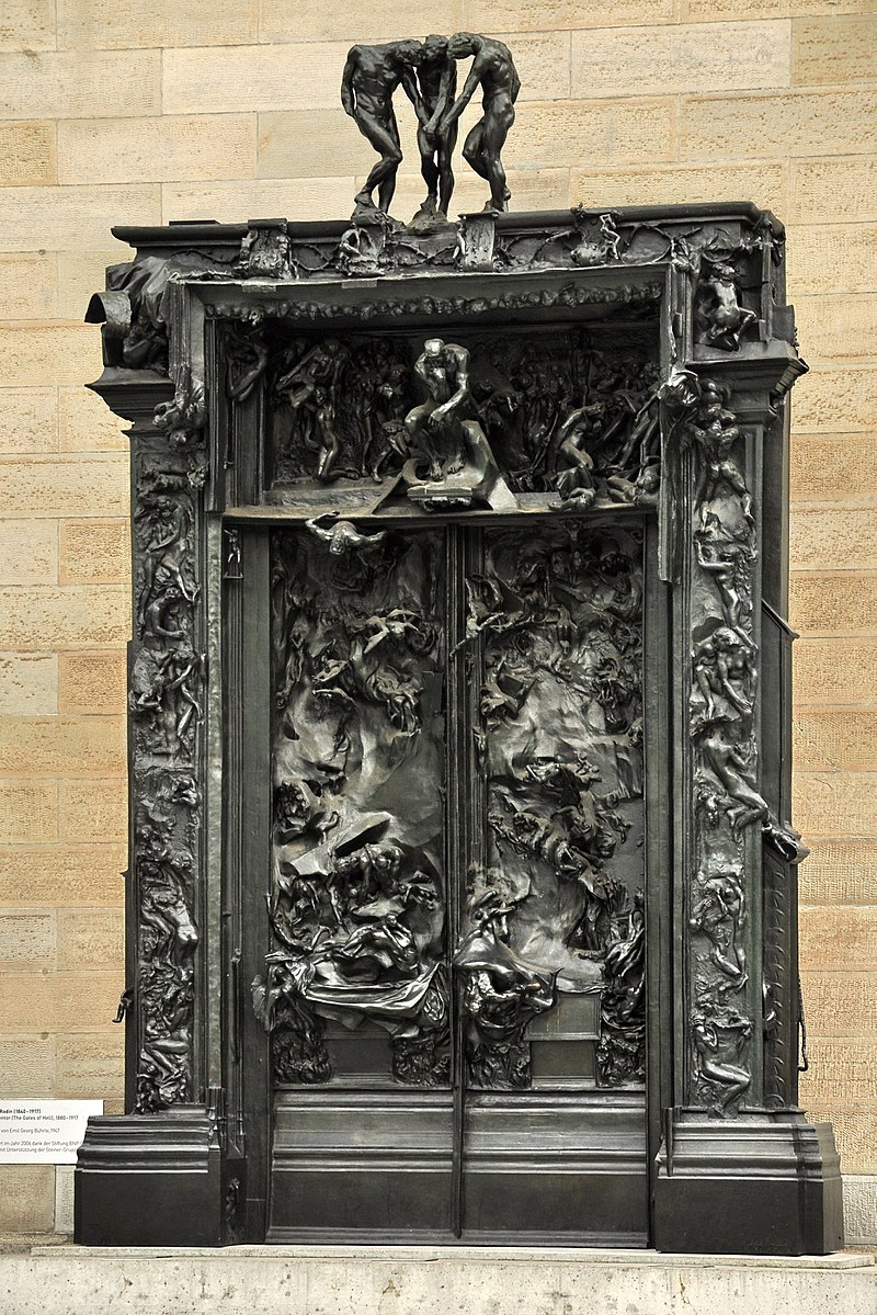 Large gates of bronze with many religious scenes on the facade