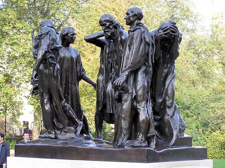 A Bronze statue of Five people standing on a stone platform 