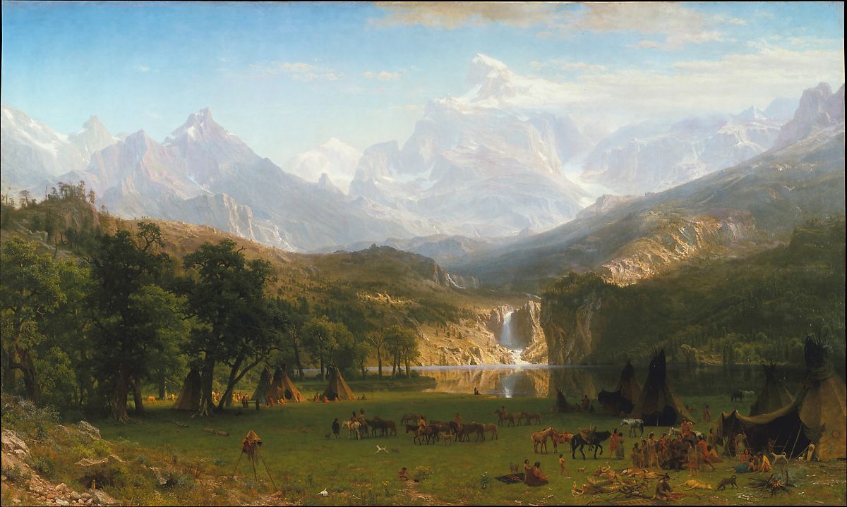 Large mountains with a waterfall and people camping in the meadow