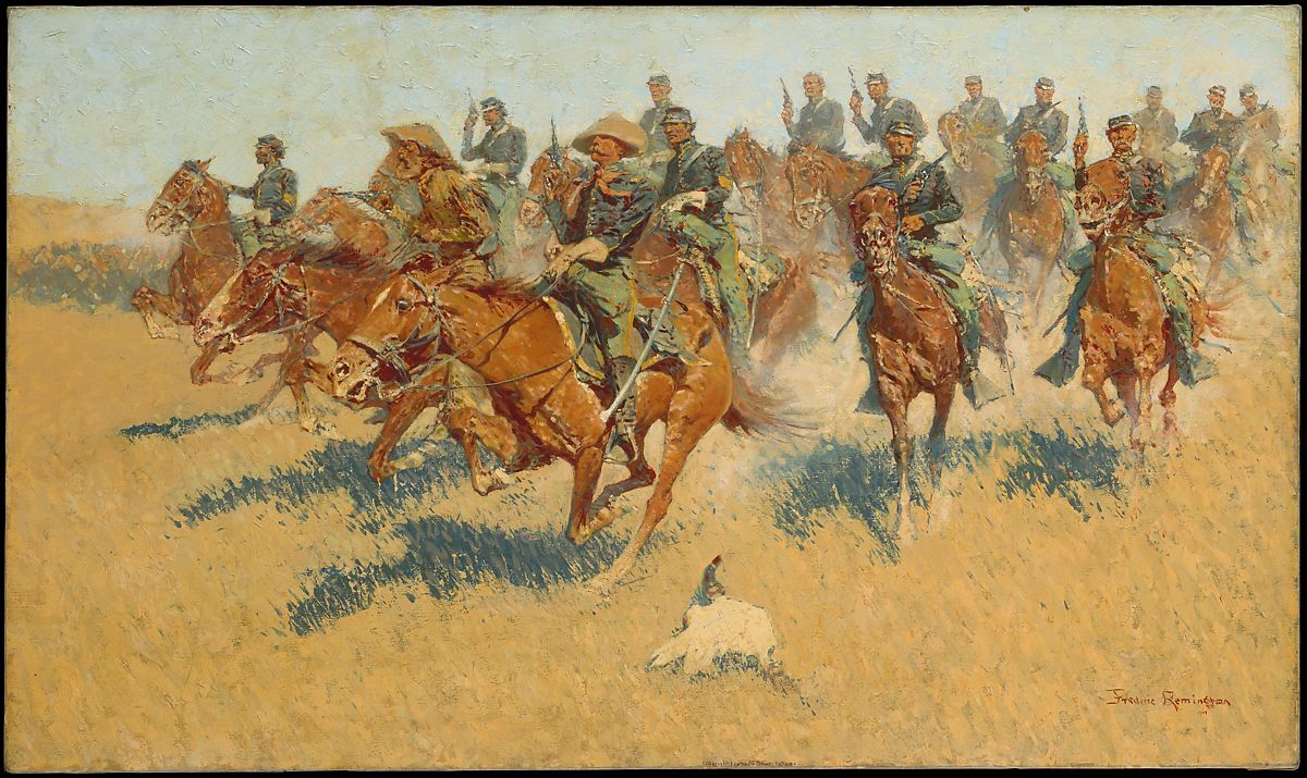 Several men on horse back with guns pointing up to the sky