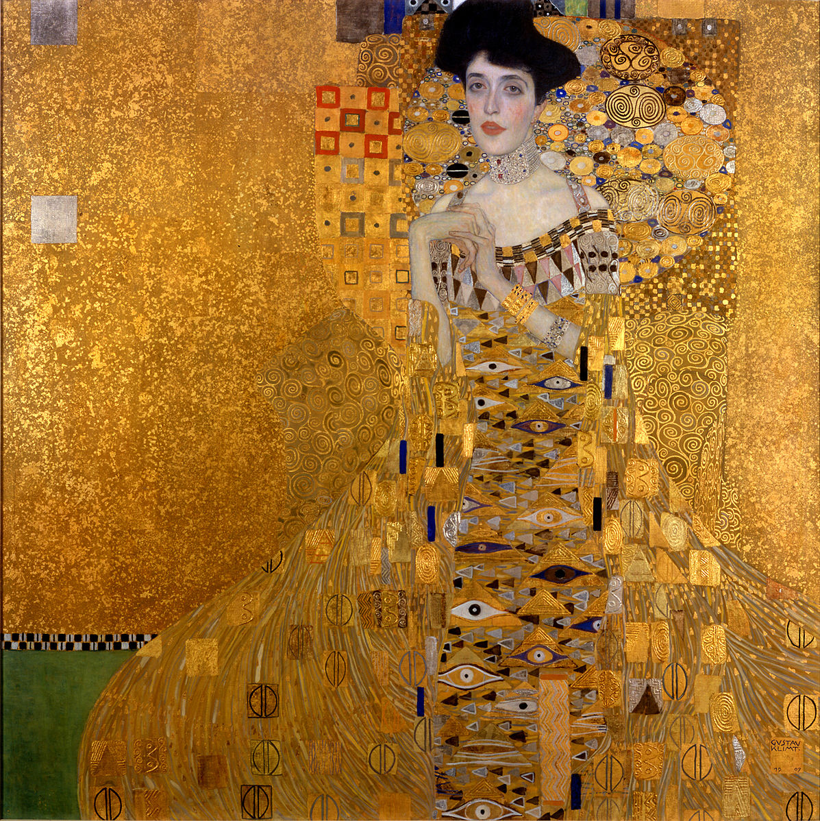 A woman in a gold and black dress against a gold background