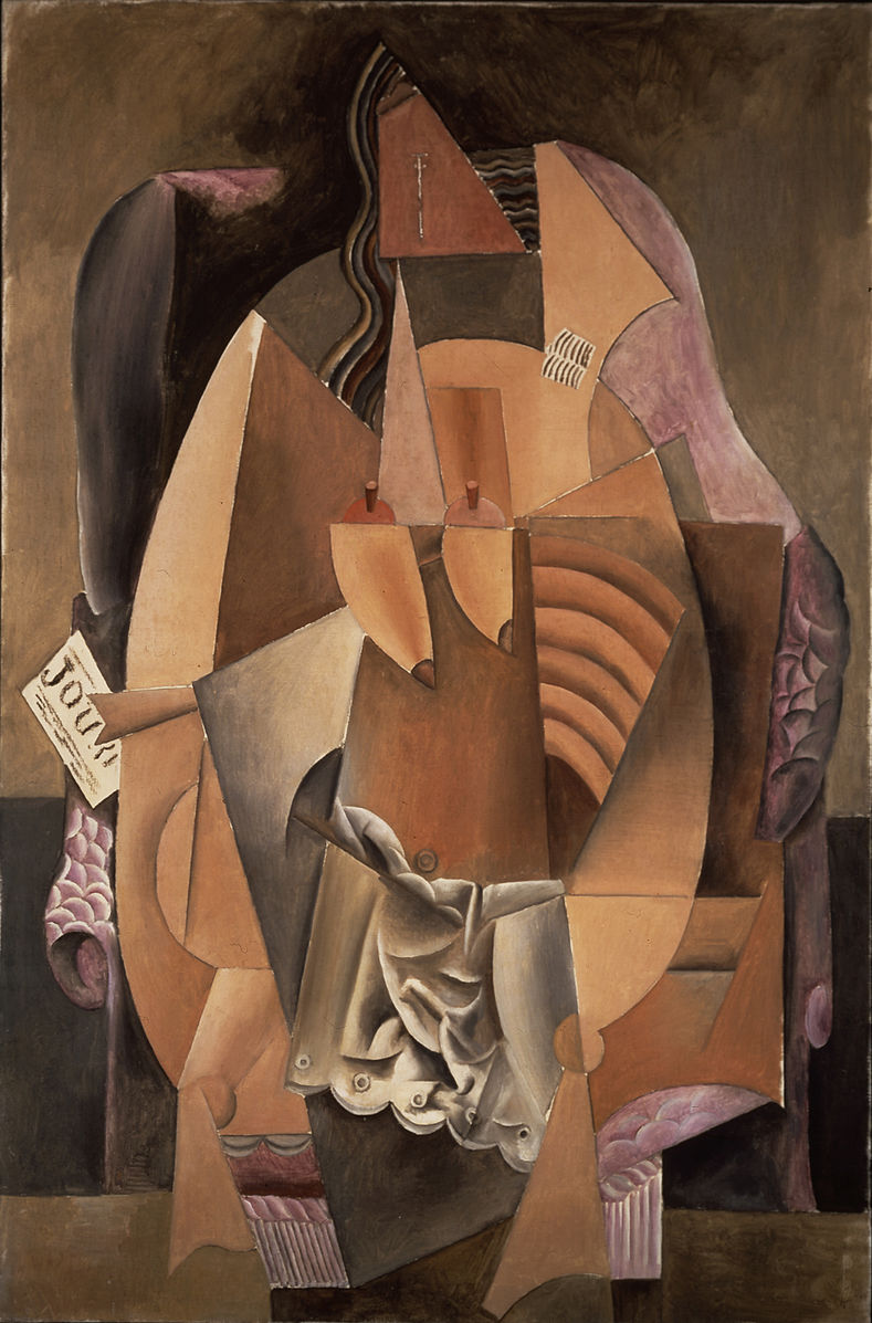 A nude woman sitting in a chair holding a journal