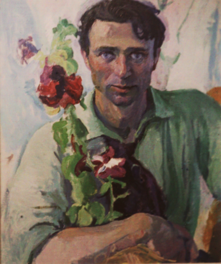 A man in a green shirt holding a vase of flowers