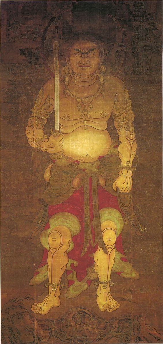 Un hombre de pie y sosteniendo una espada