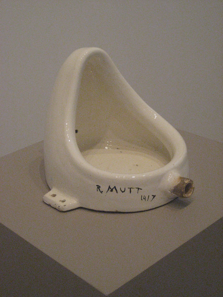 A white urinal on a table