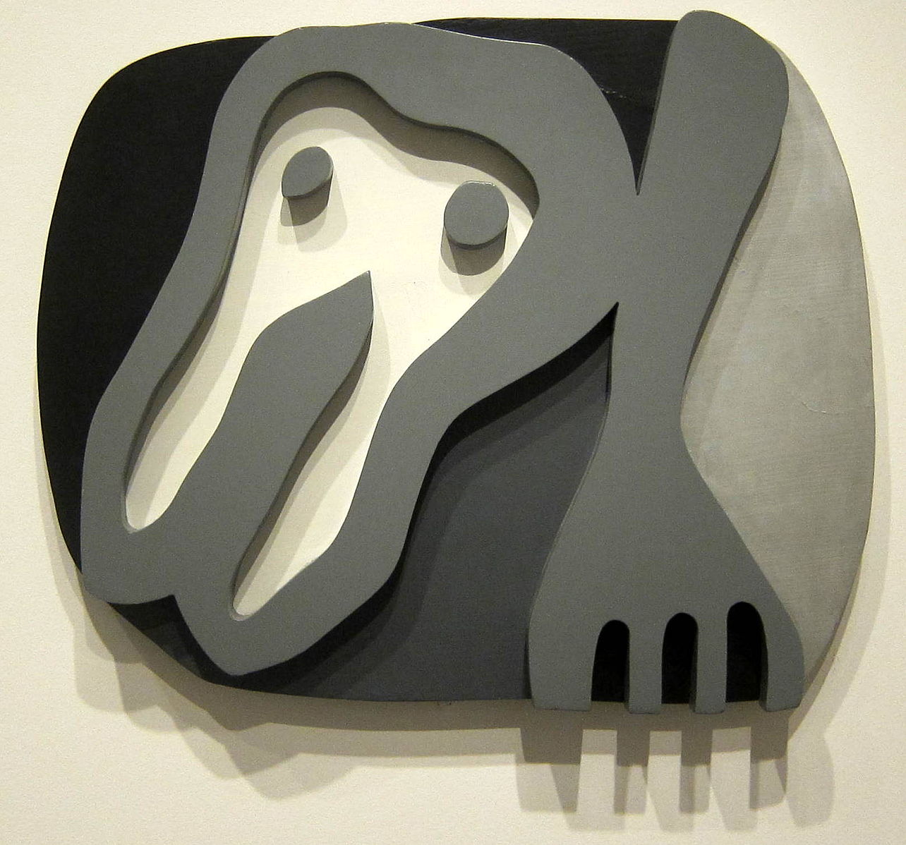 A black and white tooth and fork