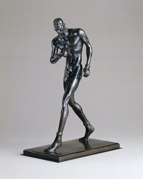 A bronze statue of a boxer