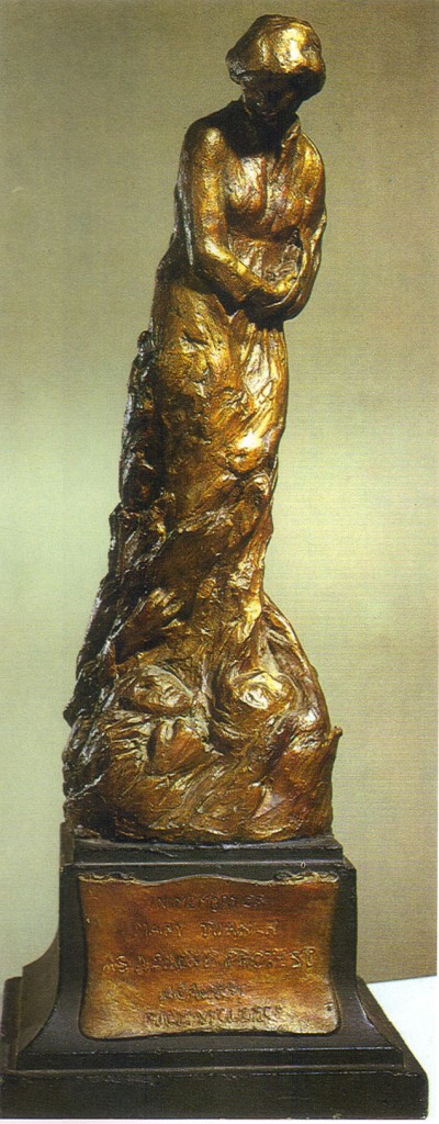 A bronze statue of a young woman 