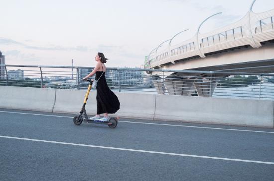 A woman on a scooter