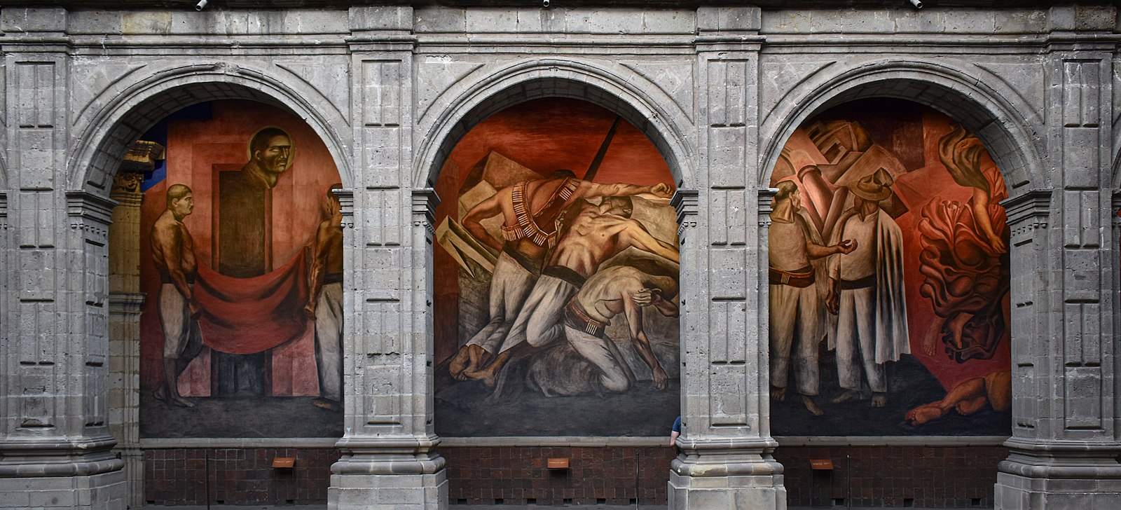 A mural scene with five men in three different parts