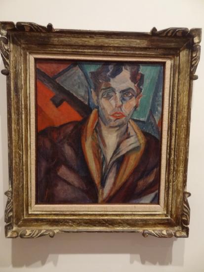 Portrait of a man with brown hair and brown jacket 