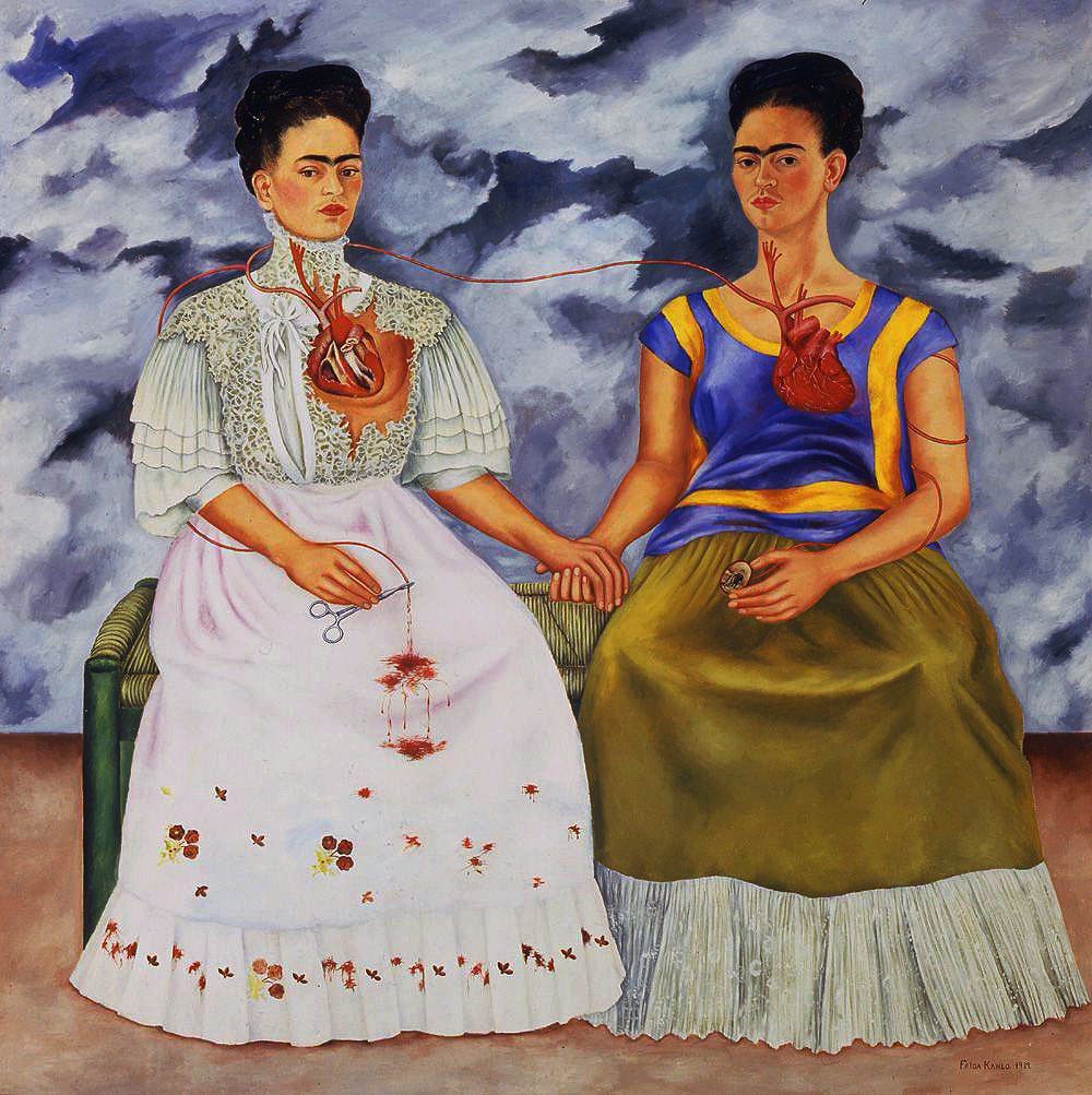Two women sitting in chairs with their hearts exposed and a veil connecting them