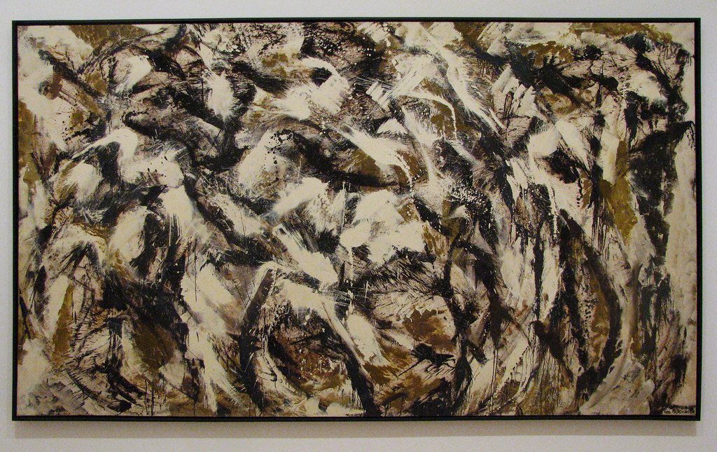 A painting of multiple colors of brown, white, and black with multiple brush strokes