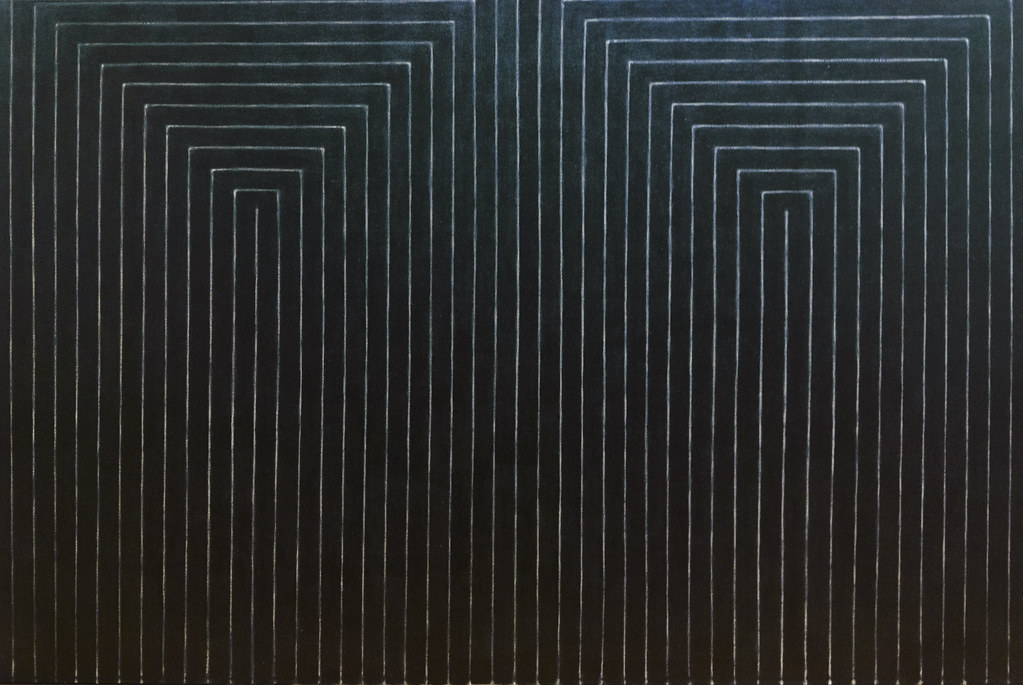 A black painting with white geometric lines