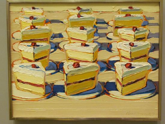 Several slices of cakes with white frosting and cherries