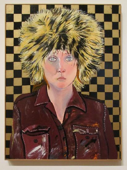 a woman with a large fur cap wearing a leather jacket against a checkerboard background