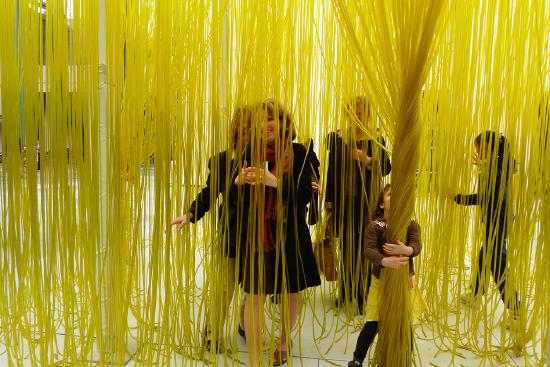 A close up picture of people walking through the nylon tubes