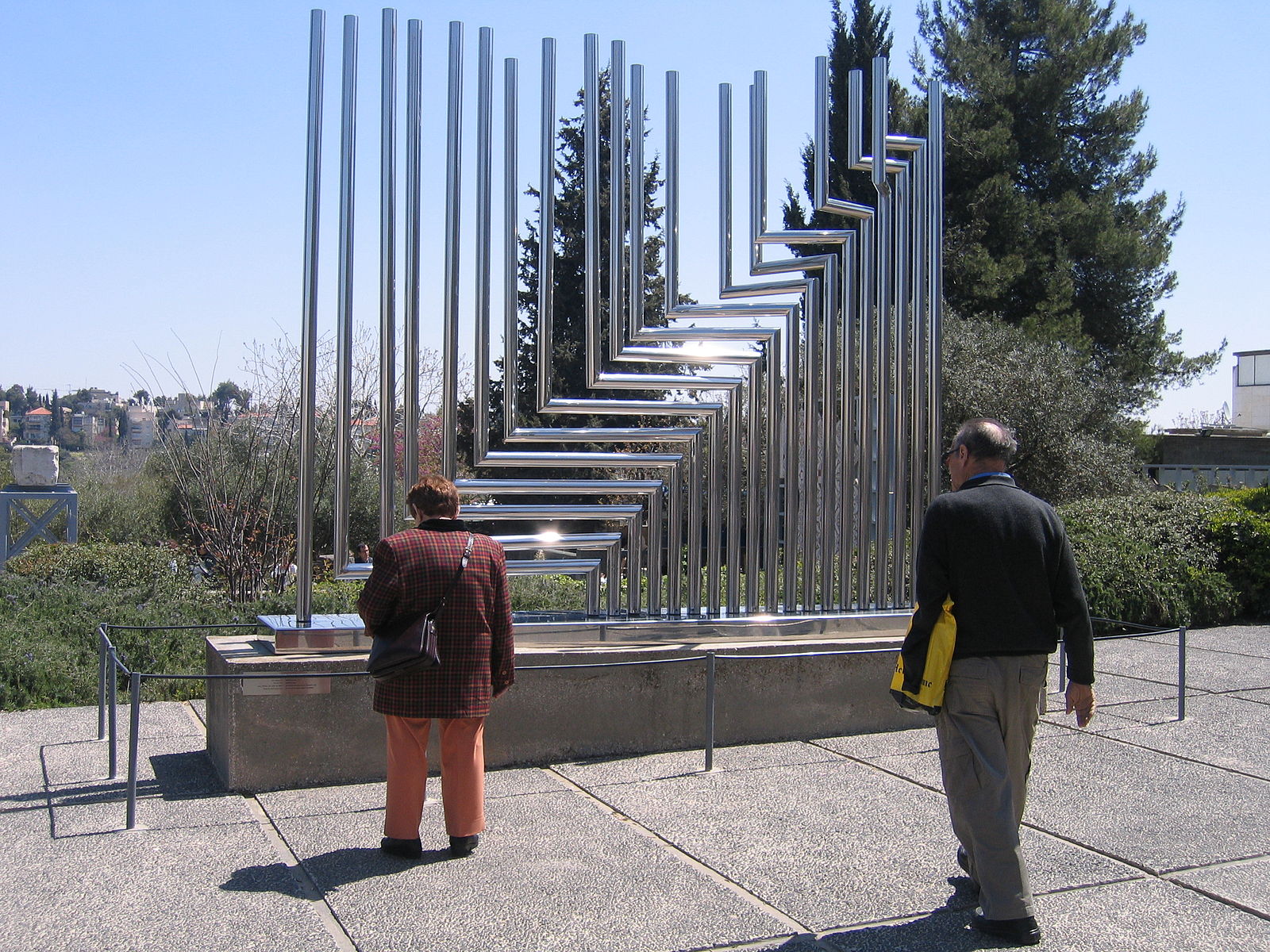 A metal tube sculpture with right angles in certain places