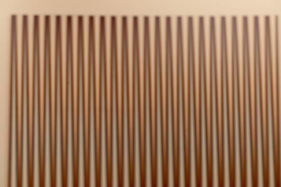 Mostly brown vertical lines on a tan background
