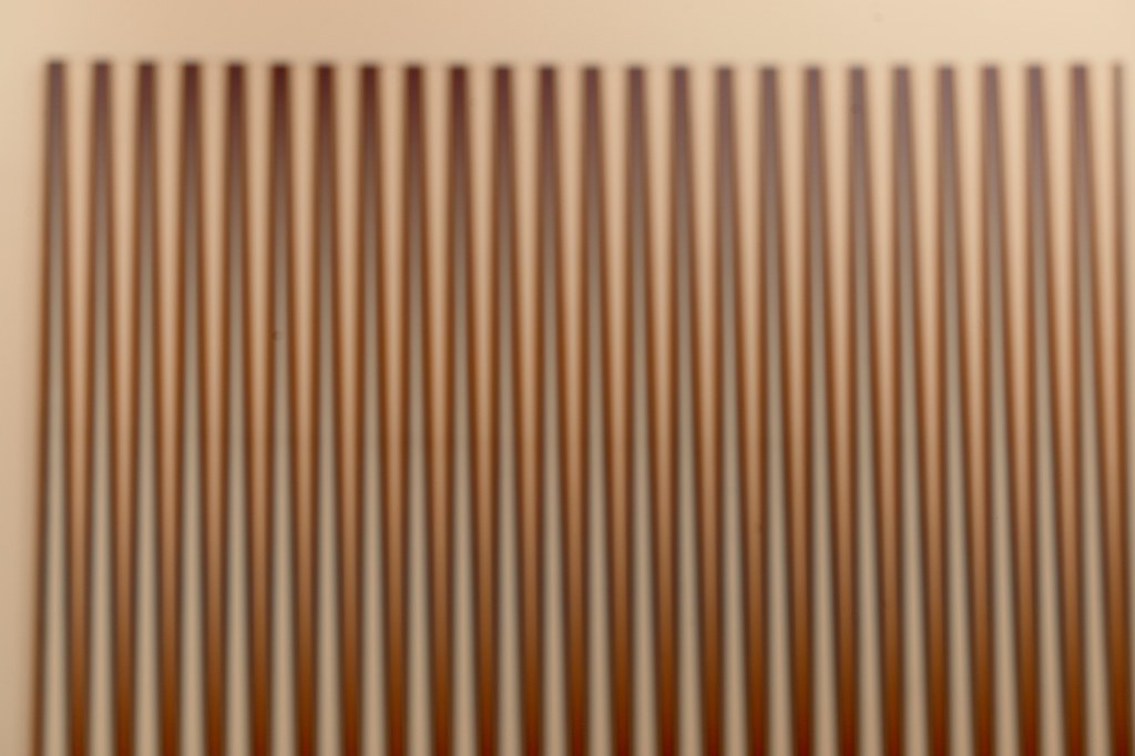 Mostly brown vertical lines on a tan background