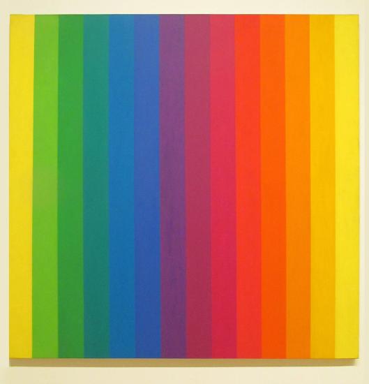 A rainbow of color painted in lines across a canvas