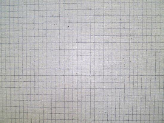 A white board with small blue lines running vertical and horizontal