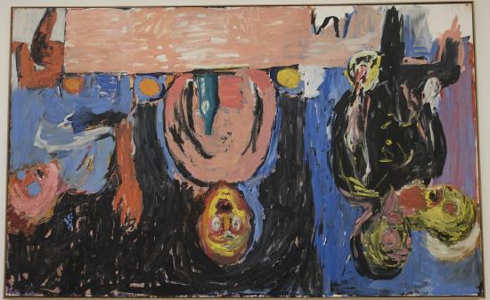 Three people at a table in multiple colors hanging upside down