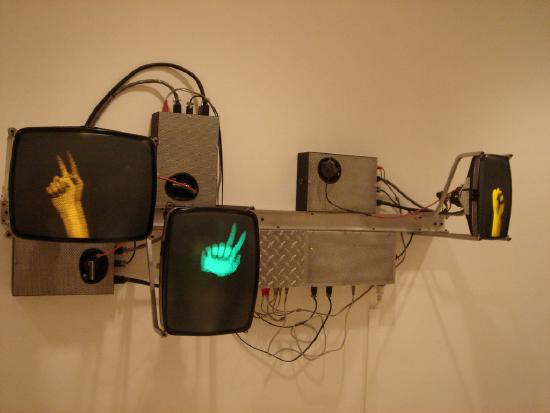 Tv monitors and misc parts with 3 hands