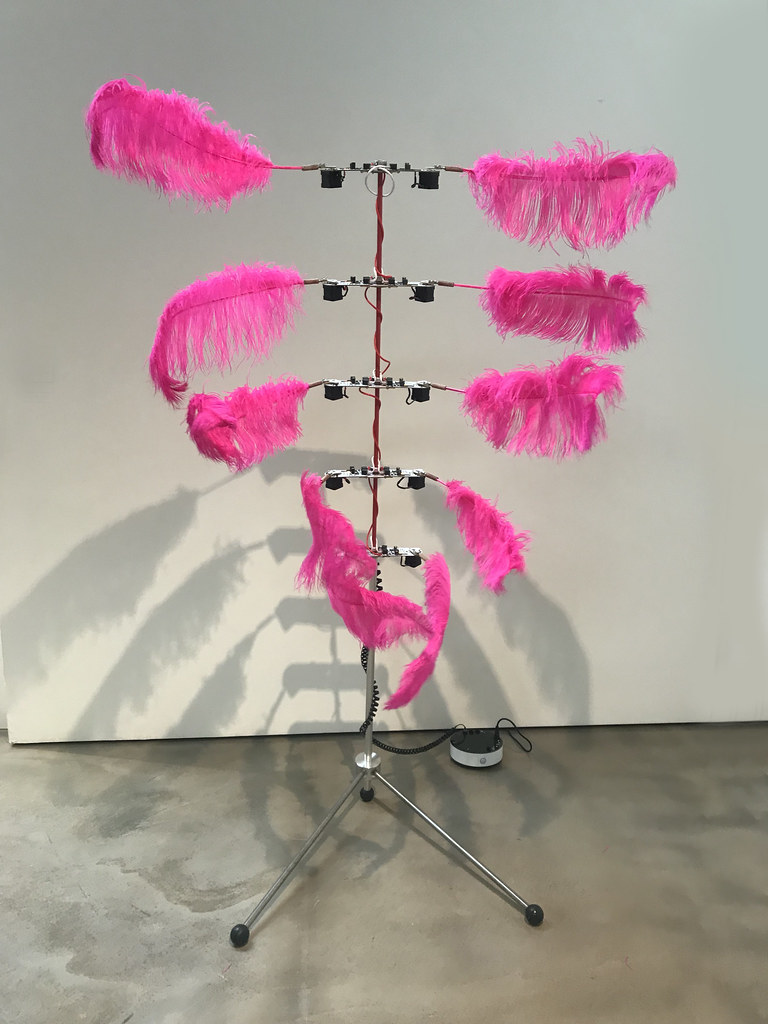 Tripod with pink feathers