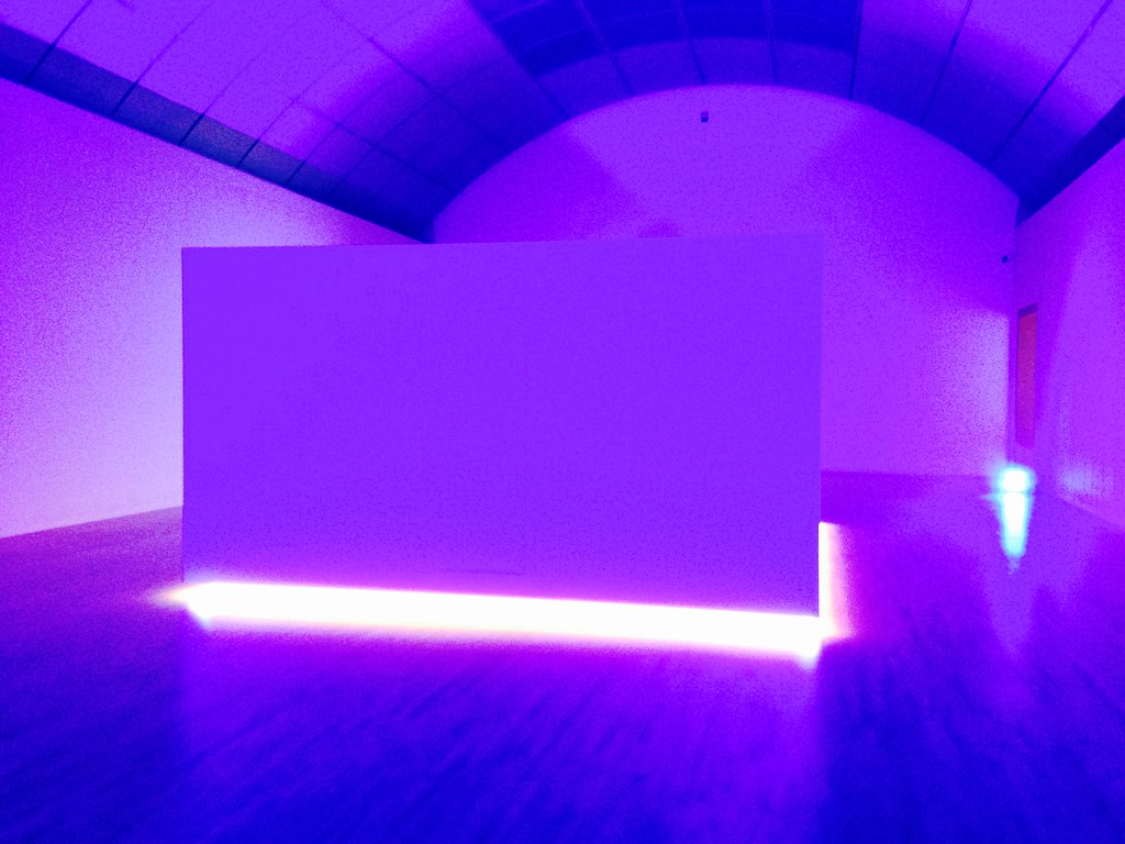 a room lit in purple and blue
