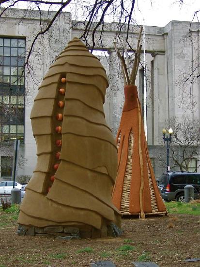 Two tent like homes made from natural materials